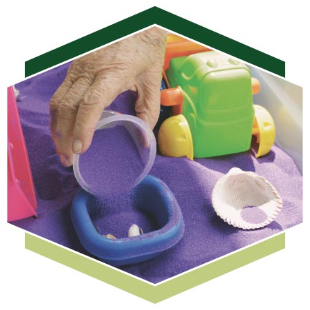 Close up of Montessori activities using sand