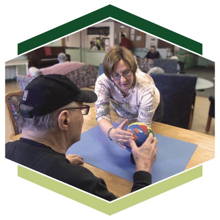 Instructor Marcy working with an Alzheimer's resident